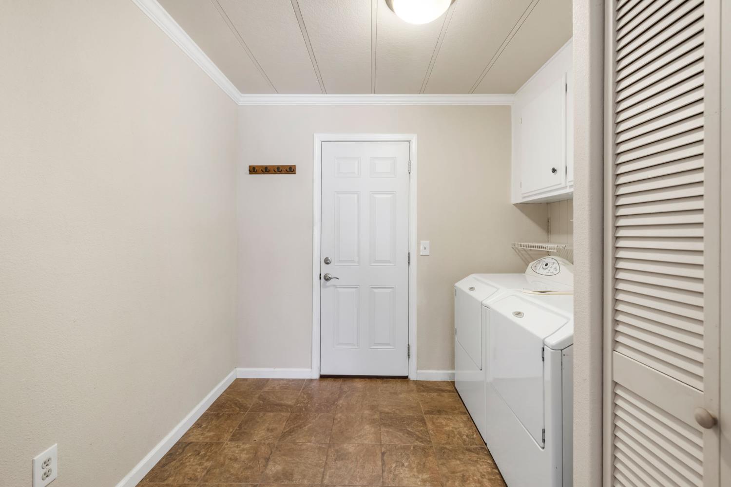 4700 Old French Town Road, Unit 64 Shingle Springs, CA 95682 - Photo 22 of 26 a view of a storage & utility room with a washer dryer