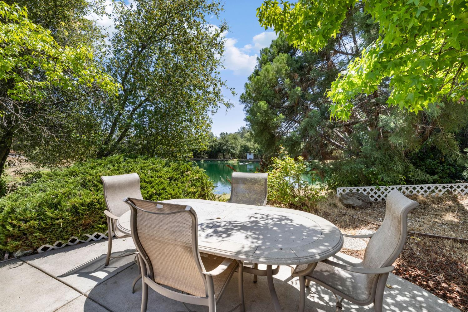 4700 Old French Town Road, Unit 64 Shingle Springs, CA 95682 - Photo 3 of 26 a view of a table and chairs in the patio