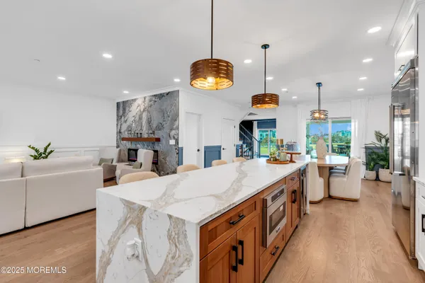 a very nice looking kitchen and a dining room with a large window