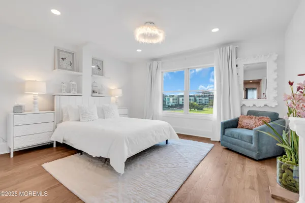 a bathroom with a sink mirror and toilet