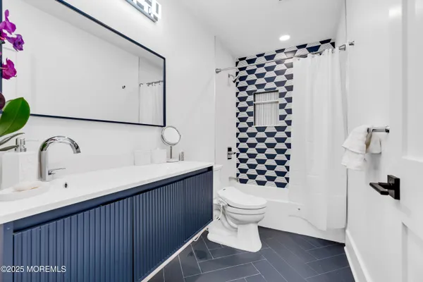 a utility room with sink dryer and washer