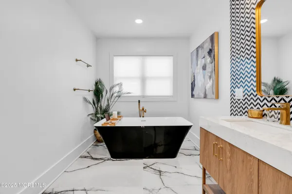 a bathroom with a bathtub and shower