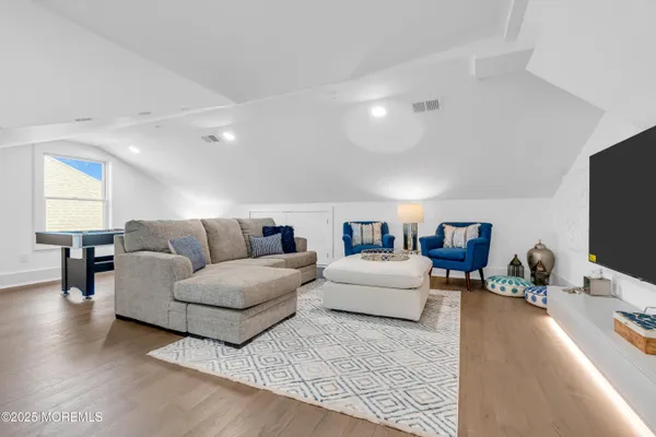 a living room with furniture and a table