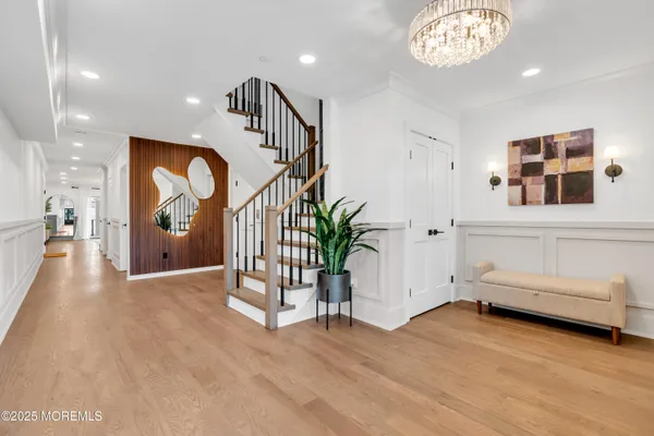 a view of entryway with wooden floor