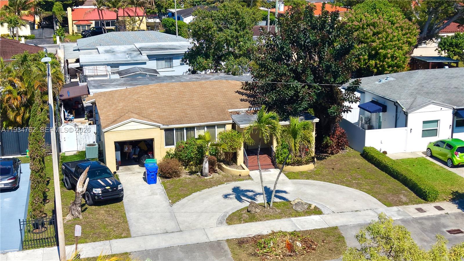 4361 Southwest 3rd Street Miami, FL 33134 - Photo 2 of 24 a view of the house with fountain in front of house