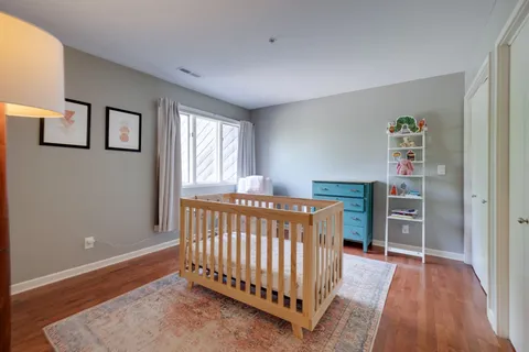 an aerial view of a house with a yard and lake view