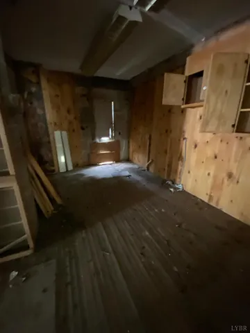 a room with gym equipment and windows