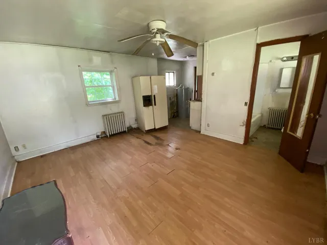 a bathroom with a toilet a sink and a window