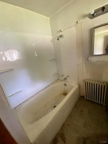 a kitchen with a refrigerator and window