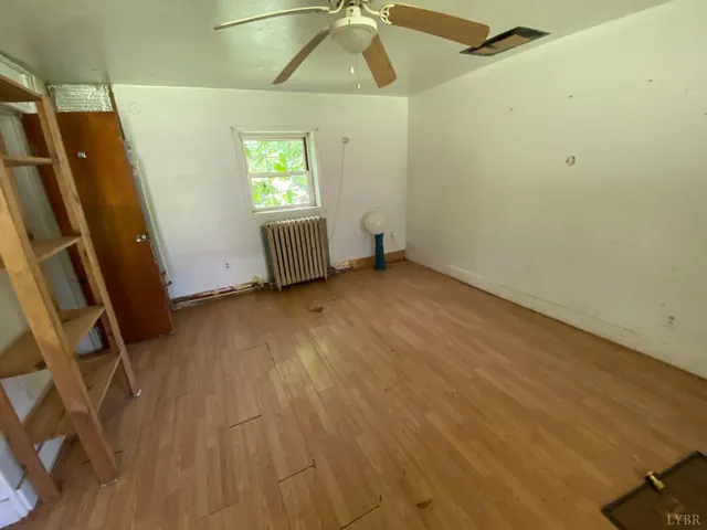 a kitchen with a refrigerator and a stove top oven