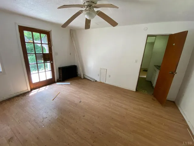 a view of room with tub and door
