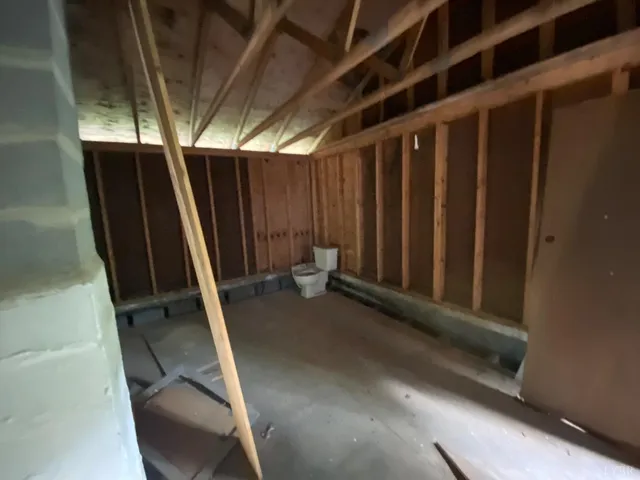 a view of an empty room with gym equipment