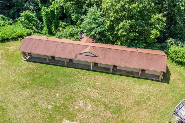 a view of a garden with a house