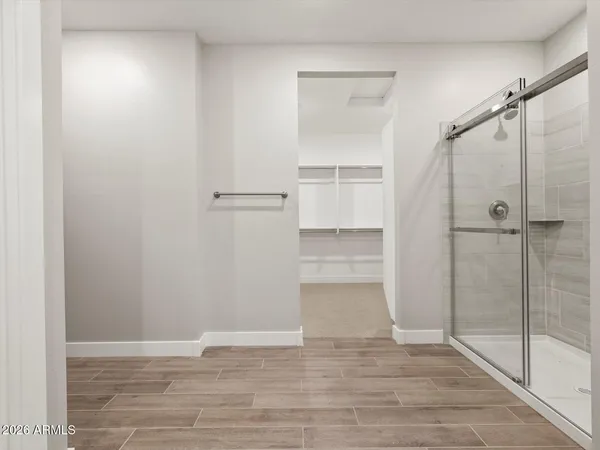 a view of hallway with wooden floor