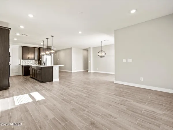 a view of a kitchen with a sink and a refrigerator