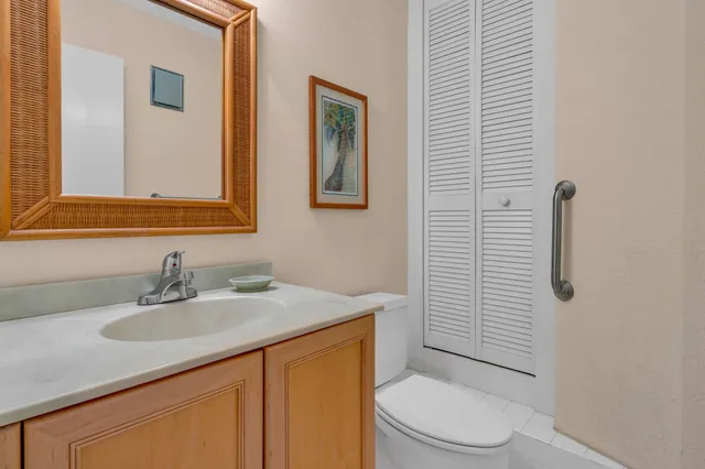 a bedroom with a balcony a bed and a chandelier