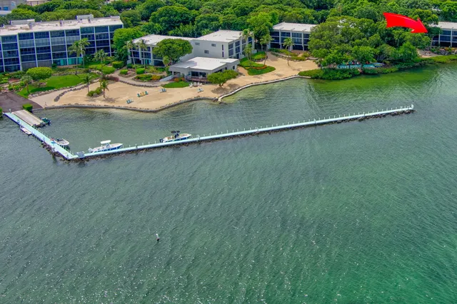a view of a swimming pool with chair and table
