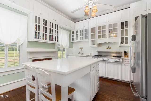 a kitchen with stainless steel appliances a stove and a refrigerator