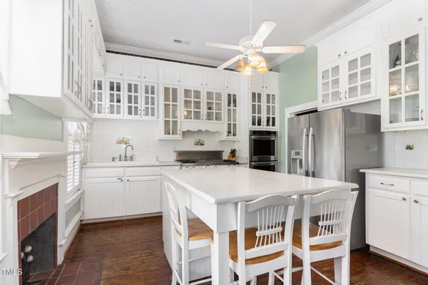 a kitchen with stainless steel appliances granite countertop a stove and a sink