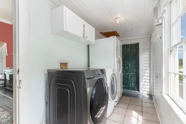 a kitchen with a stove a sink and a refrigerator