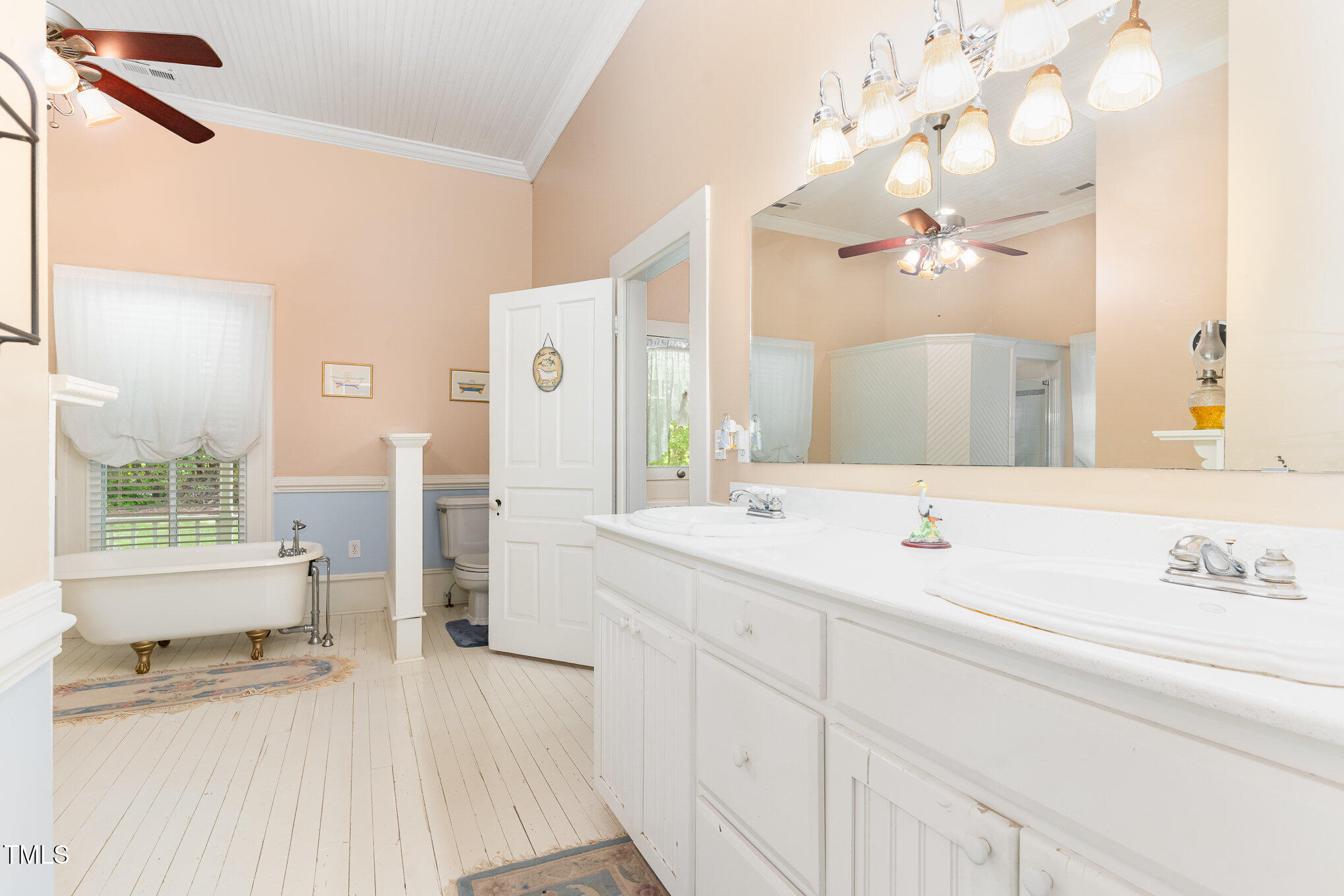 6200 Highway 401 Bunnlevel, NC 28323 - Photo 18 of 28 a spacious bathroom with a sink a large mirror and a bathtub