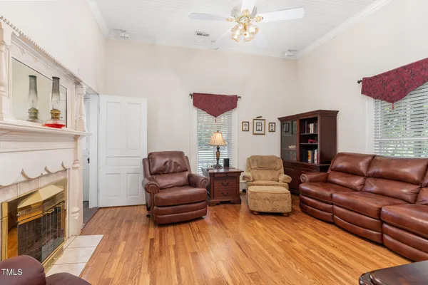 a view of a livingroom with furniture and staircase