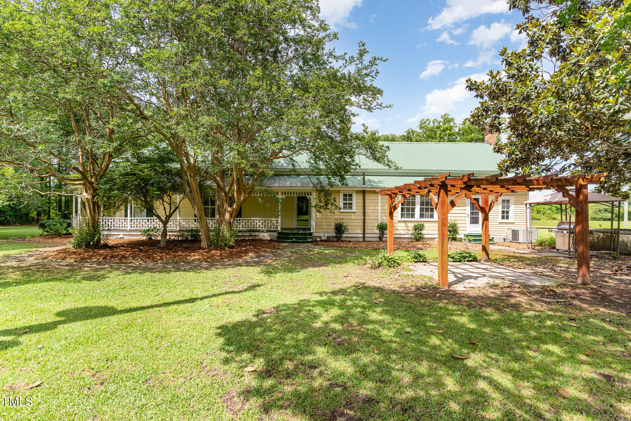 6200 Highway 401 Bunnlevel, NC 28323 - Photo 23 of 28 a view of a house with a backyard and a tree