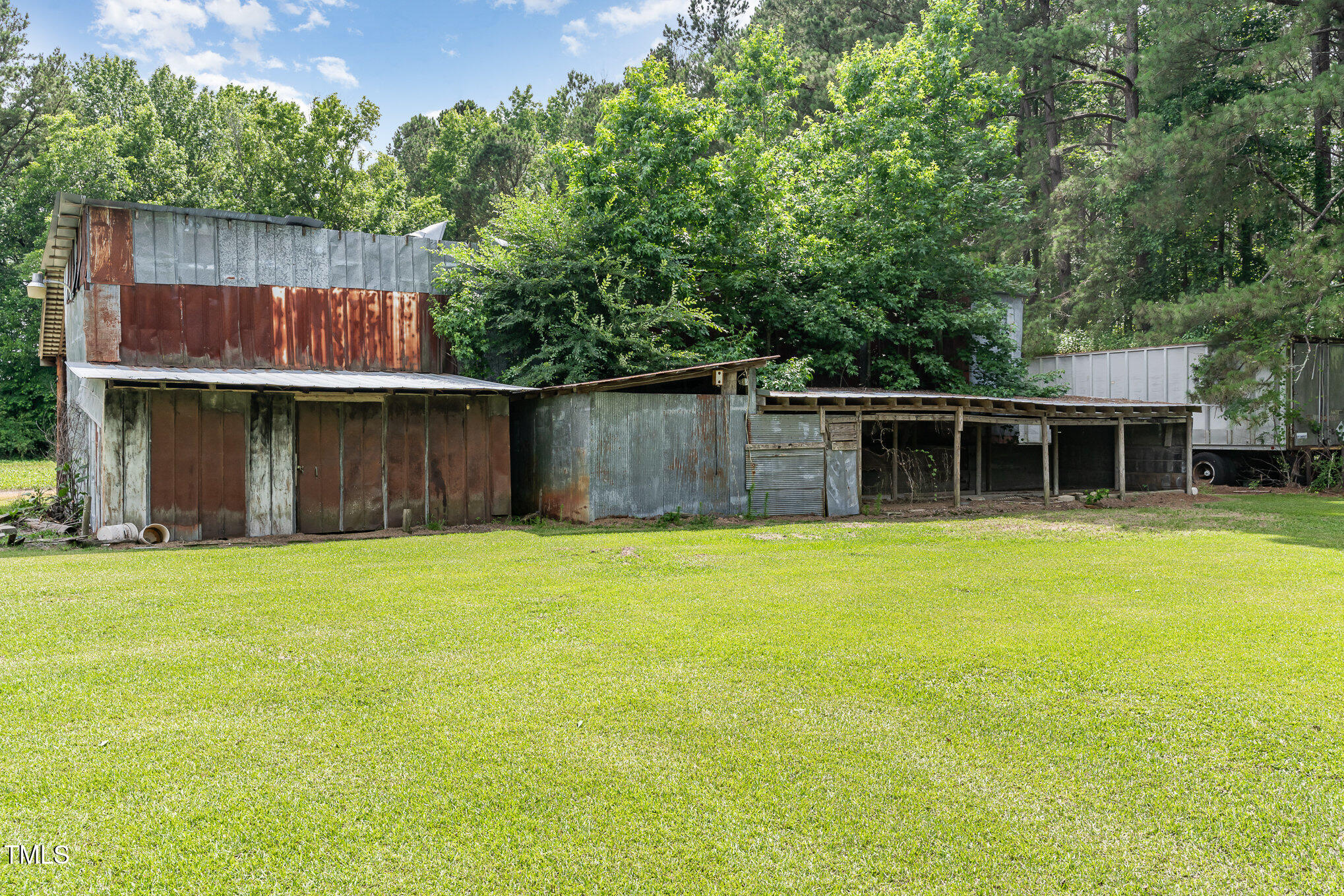 6200 Highway 401 Bunnlevel, NC 28323 - Photo 25 of 28 a front view of a house with a yard and trees