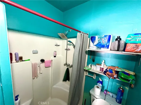 a room with lots of furniture and clutter