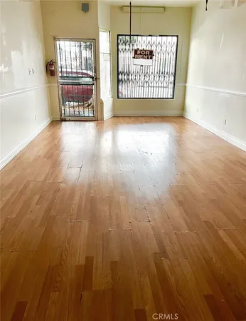 a view of a big room with wooden floor