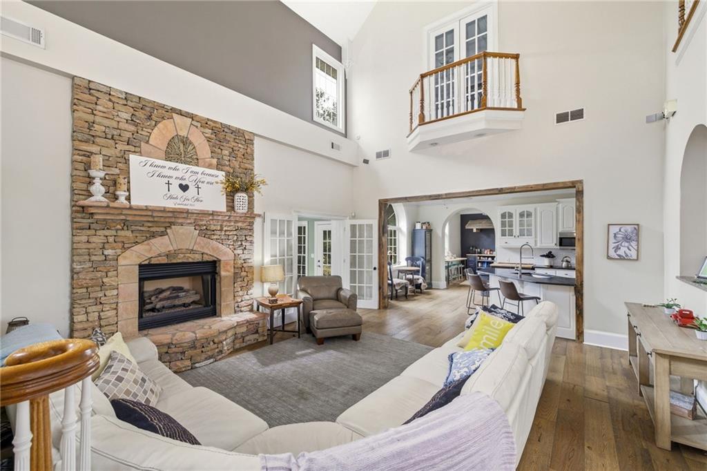 4337 Mountain View Road Oakwood, GA 30566 - Photo 14 of 84 a living room with furniture large window and fireplace