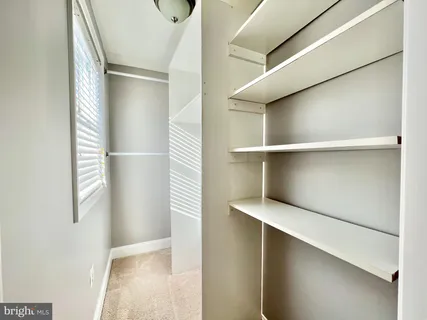 a view of an empty walk in closet