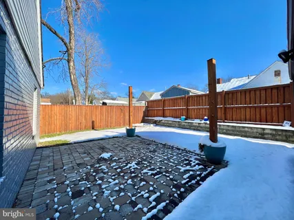 a view of a backyard of the house