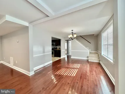 a view of entryway with wooden floor and stair