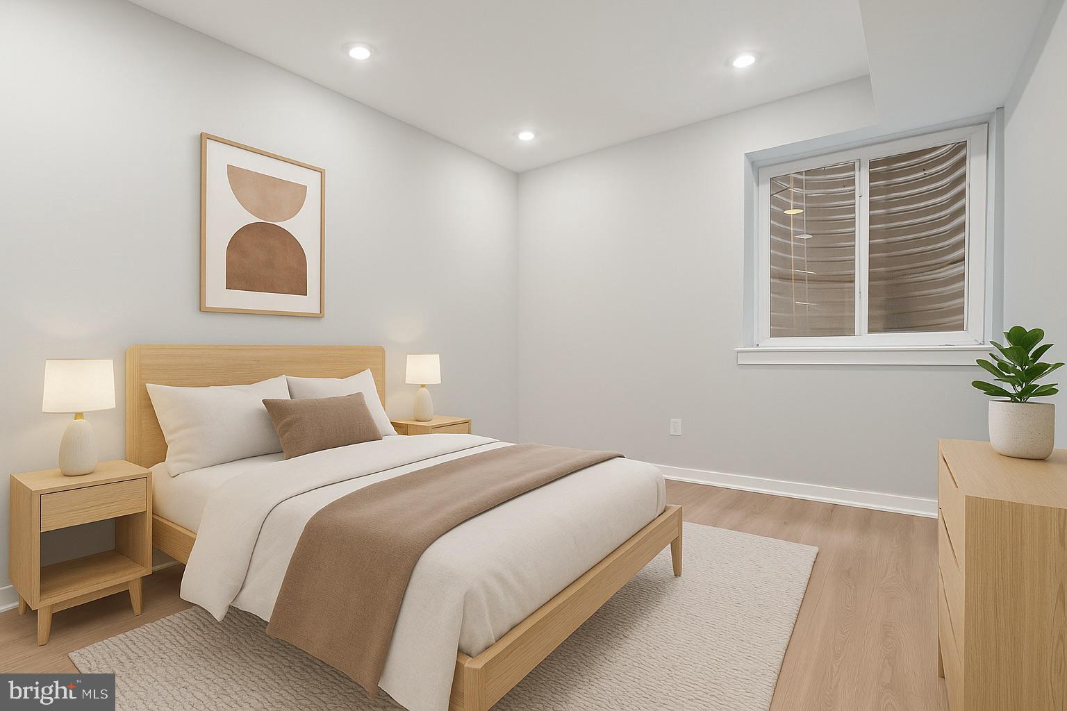 1432 Ogden Street, Unit 1 Philadelphia, PA 19130 - Photo 11 of 17 a bedroom with a bed and a window