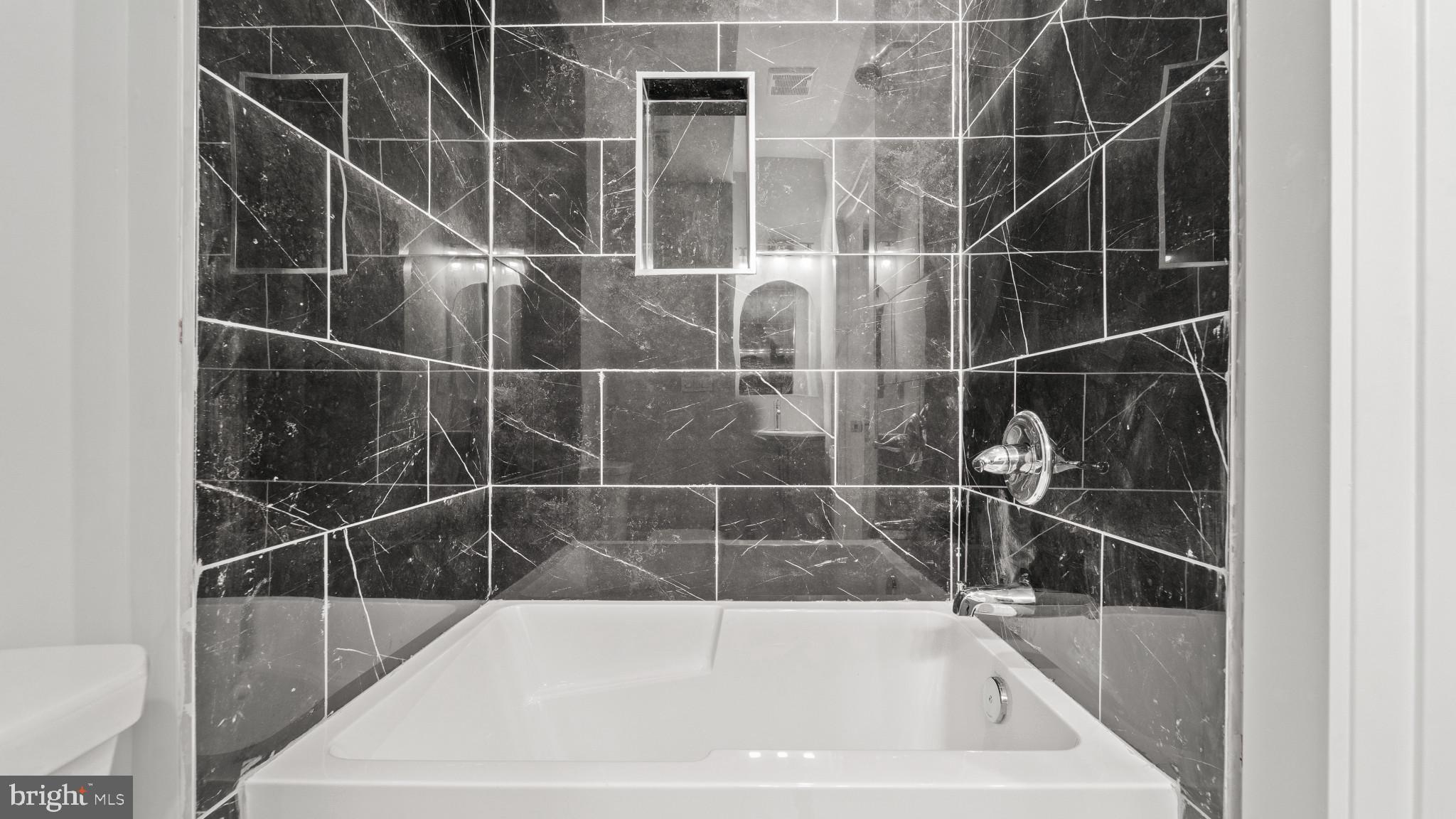 1432 Ogden Street, Unit 1 Philadelphia, PA 19130 - Photo 12 of 17 a bathroom with a bathtub