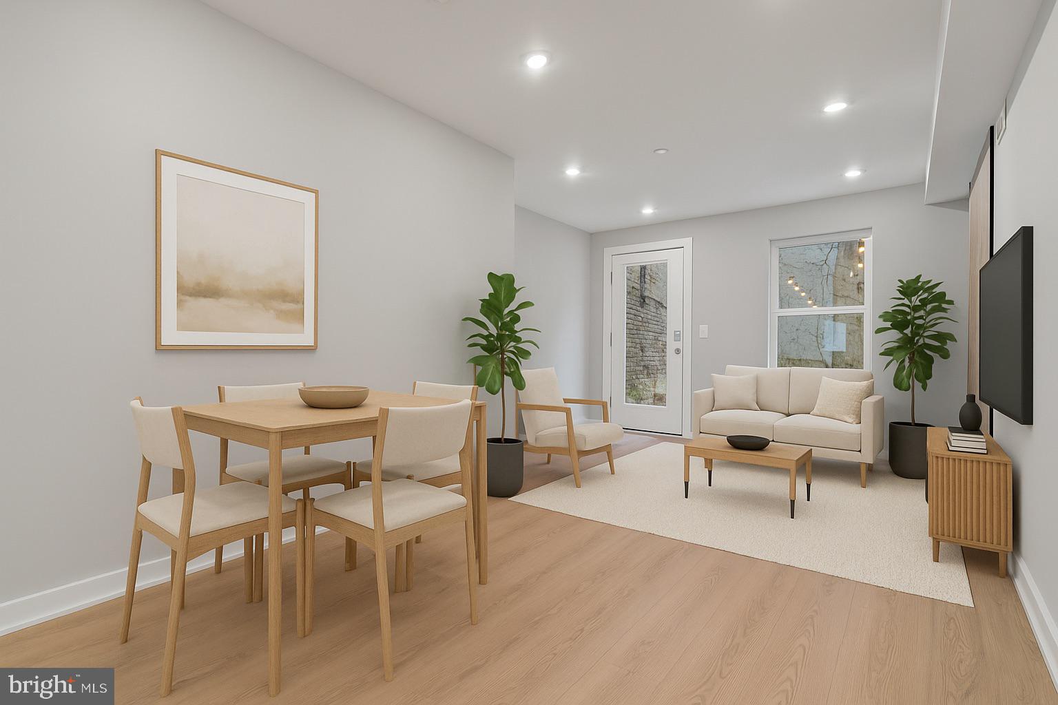 1432 Ogden Street, Unit 1 Philadelphia, PA 19130 - Photo 3 of 17 a living room with furniture potted plant and a window