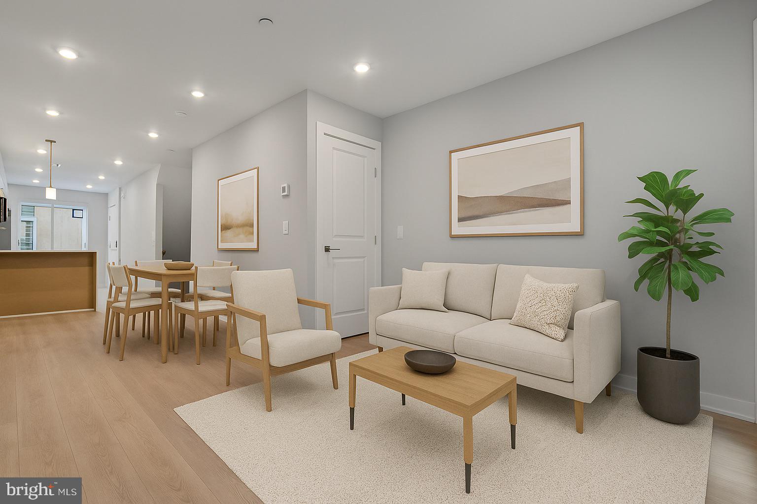 1432 Ogden Street, Unit 1 Philadelphia, PA 19130 - Photo 5 of 17 a living room with furniture potted plant and a table