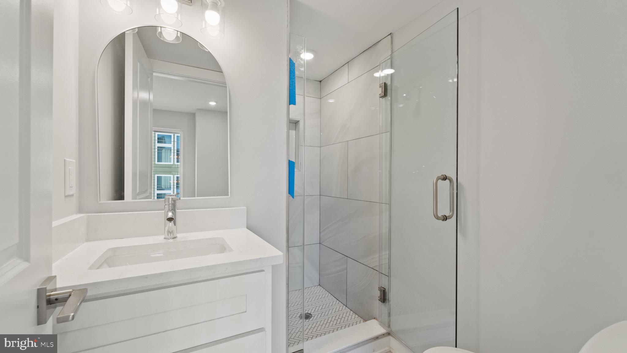 1432 Ogden Street, Unit 1 Philadelphia, PA 19130 - Photo 8 of 17 a bathroom with a shower and a sink