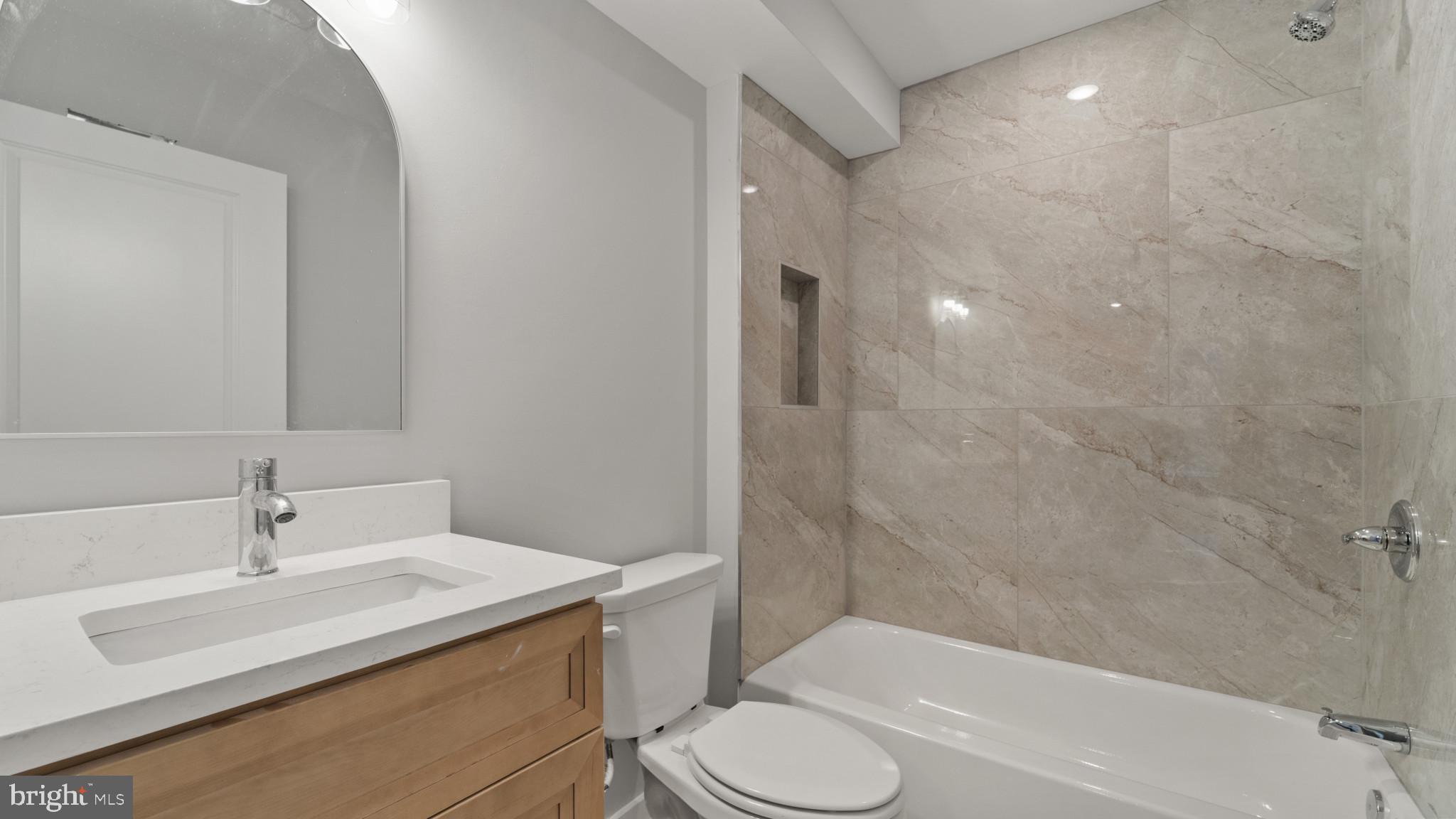 1432 Ogden Street, Unit 1 Philadelphia, PA 19130 - Photo 10 of 17 a bathroom with a sink toilet and shower