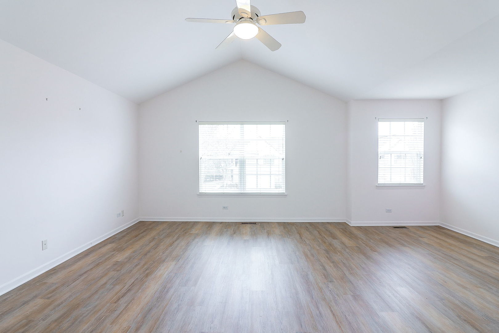 1302 Filly Lane Bartlett, IL 60103 - Photo 15 of 29 wooden floor in an empty room with a window