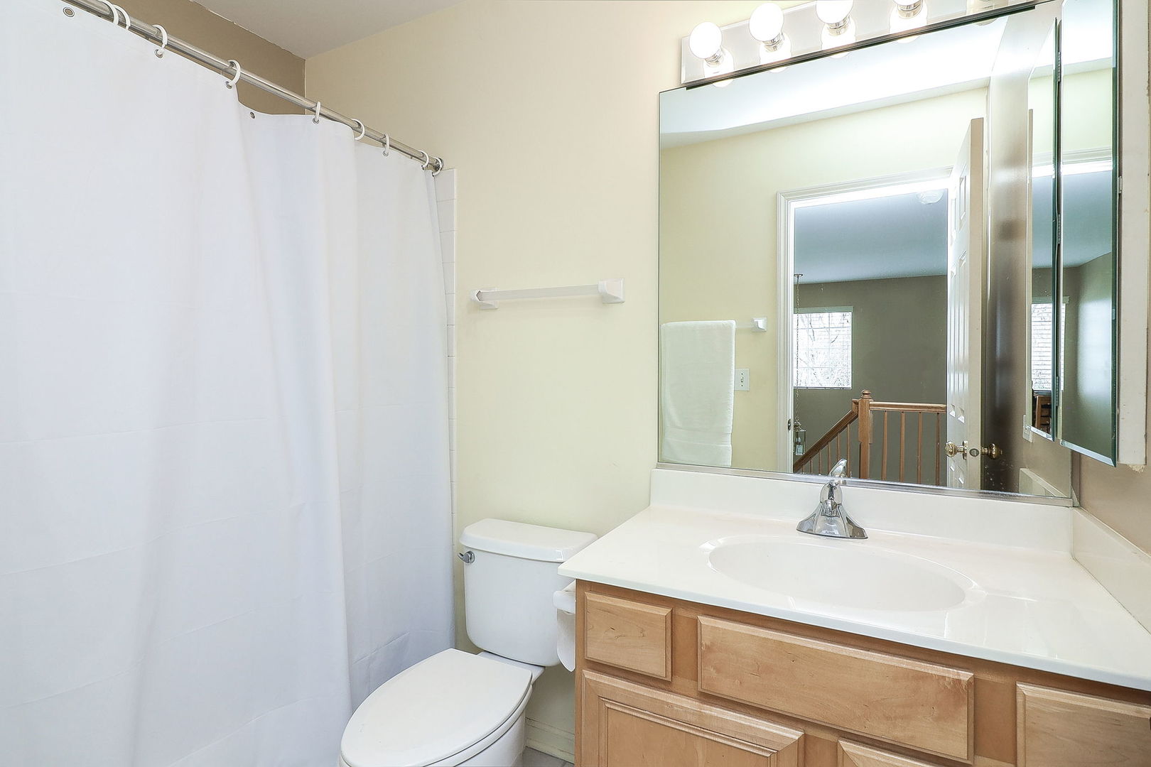 1302 Filly Lane Bartlett, IL 60103 - Photo 19 of 29 a bathroom with a sink toilet and mirror