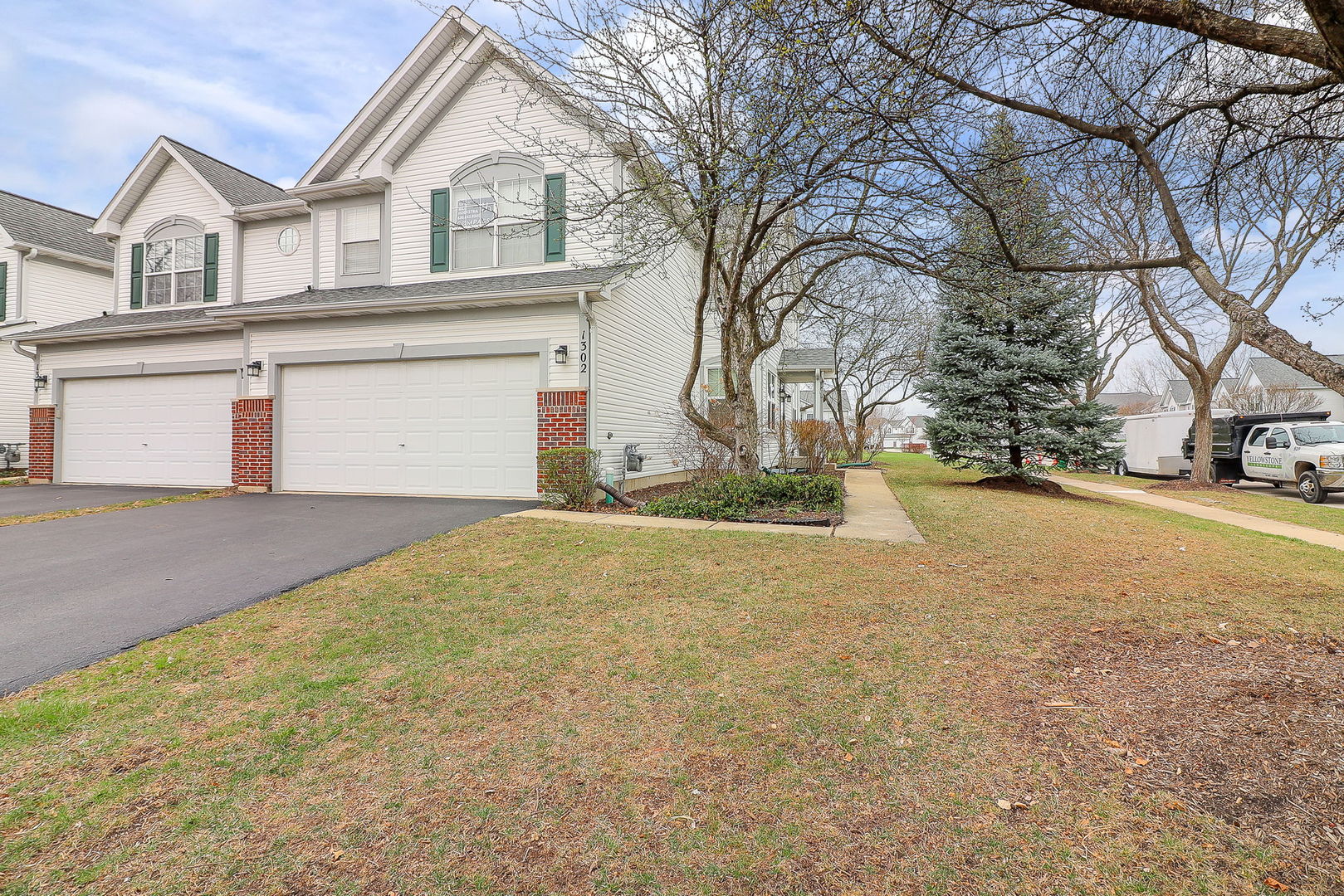 1302 Filly Lane Bartlett, IL 60103 - Photo 22 of 29 a view of white house with a large tree and yard