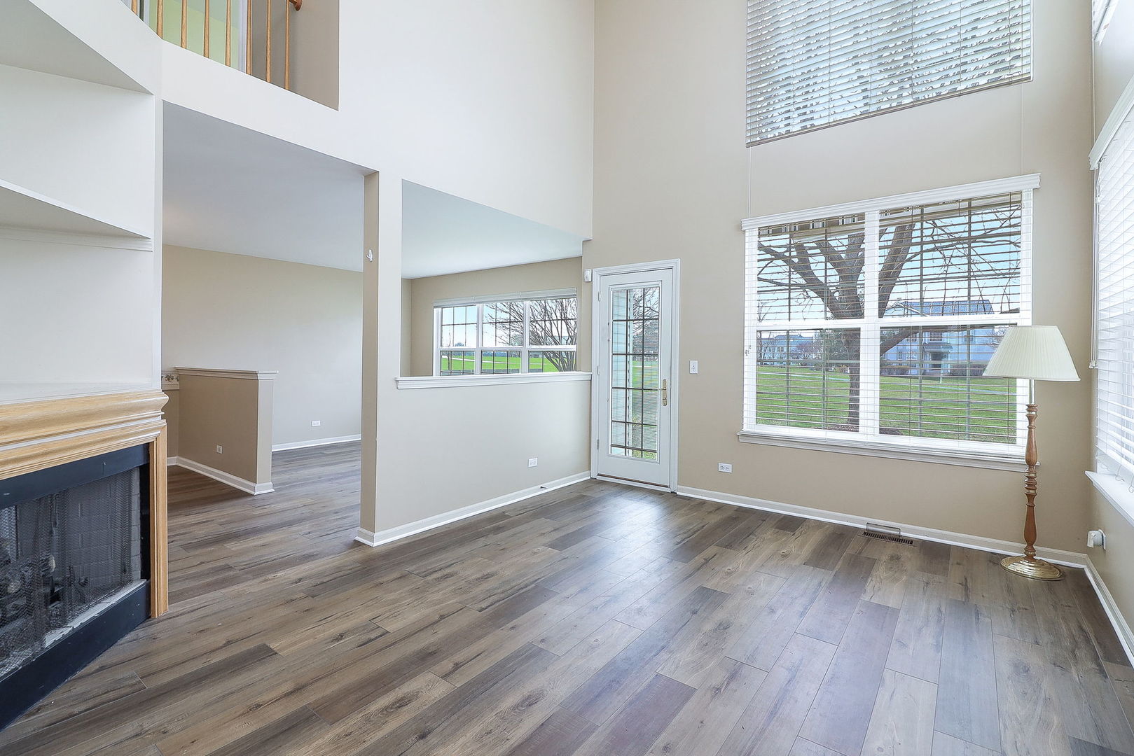 1302 Filly Lane Bartlett, IL 60103 - Photo 4 of 29 an empty room with wooden floor and windows