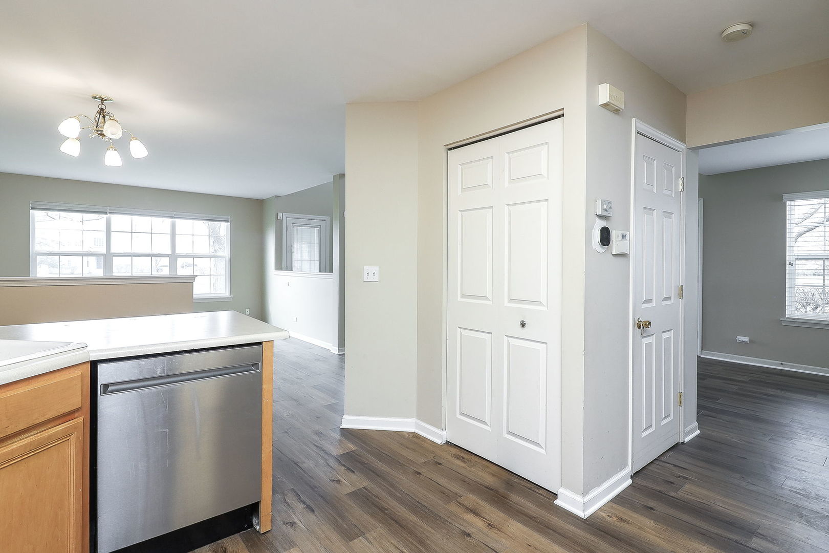 1302 Filly Lane Bartlett, IL 60103 - Photo 9 of 29 a kitchen with white cabinets and wooden floors