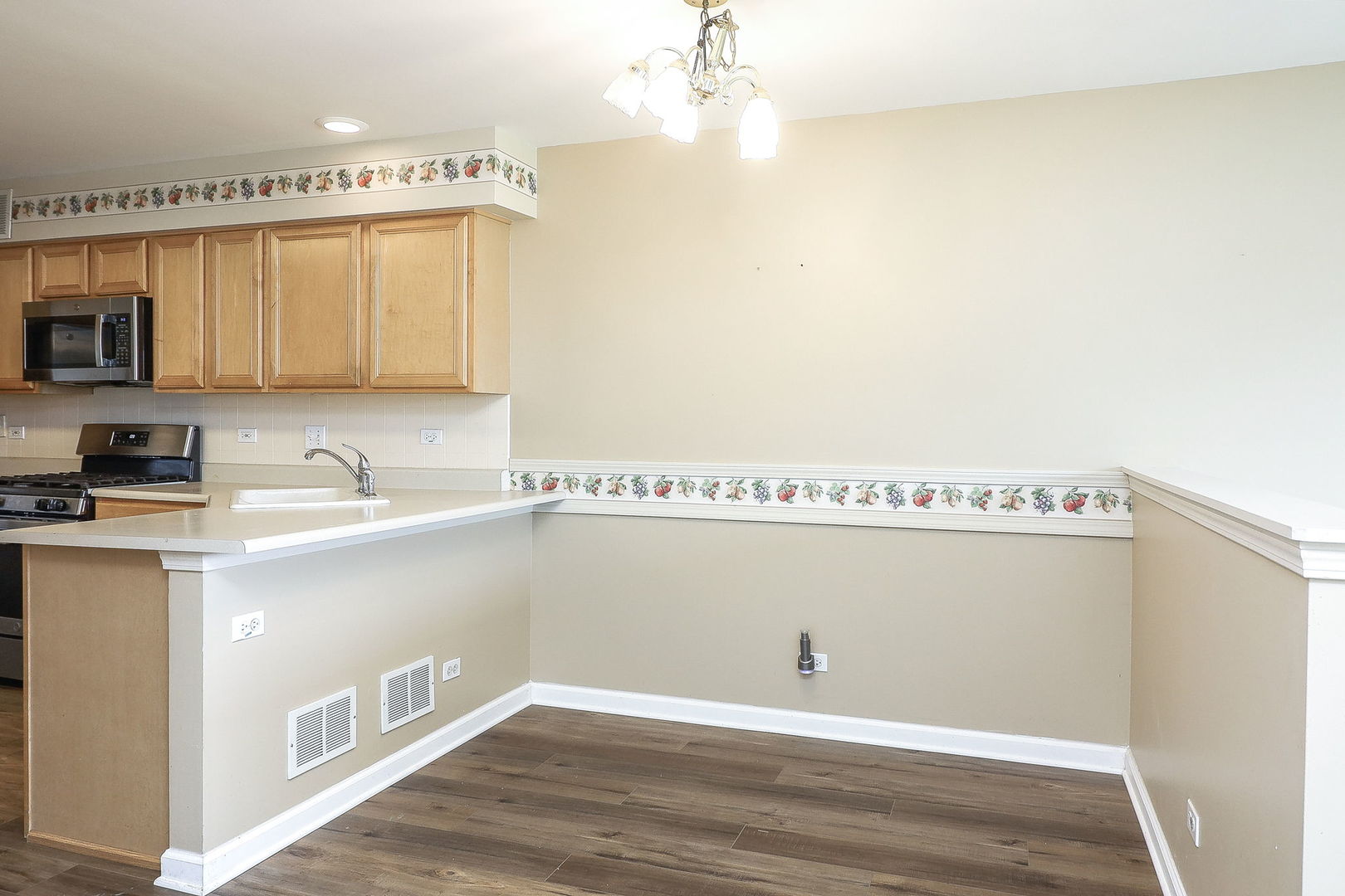 1302 Filly Lane Bartlett, IL 60103 - Photo 10 of 29 a view of cabinets with wooden floor