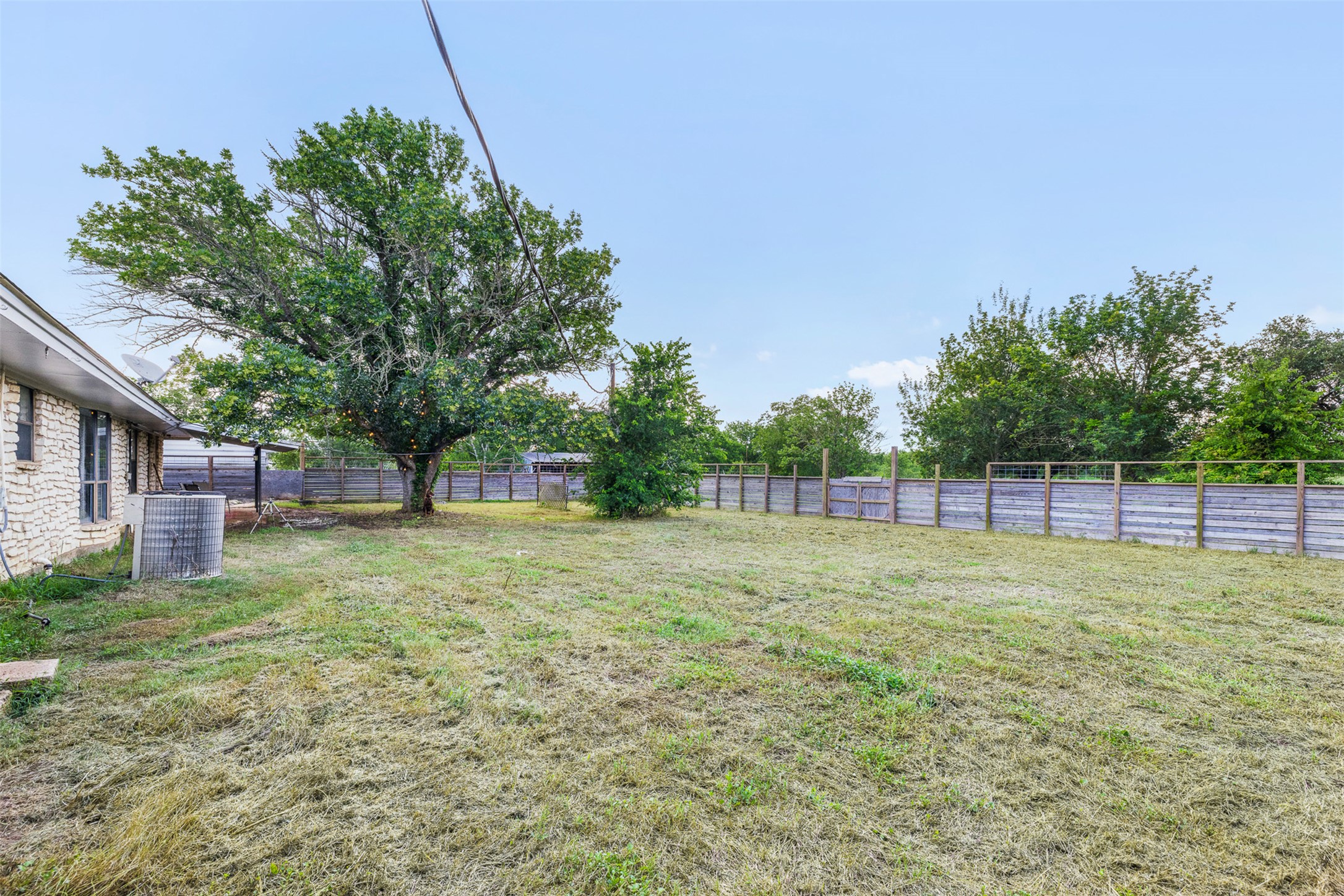 1015 FM 112 Road Lexington, TX 78947 - Photo 25 of 38 a view of a yard with a tree