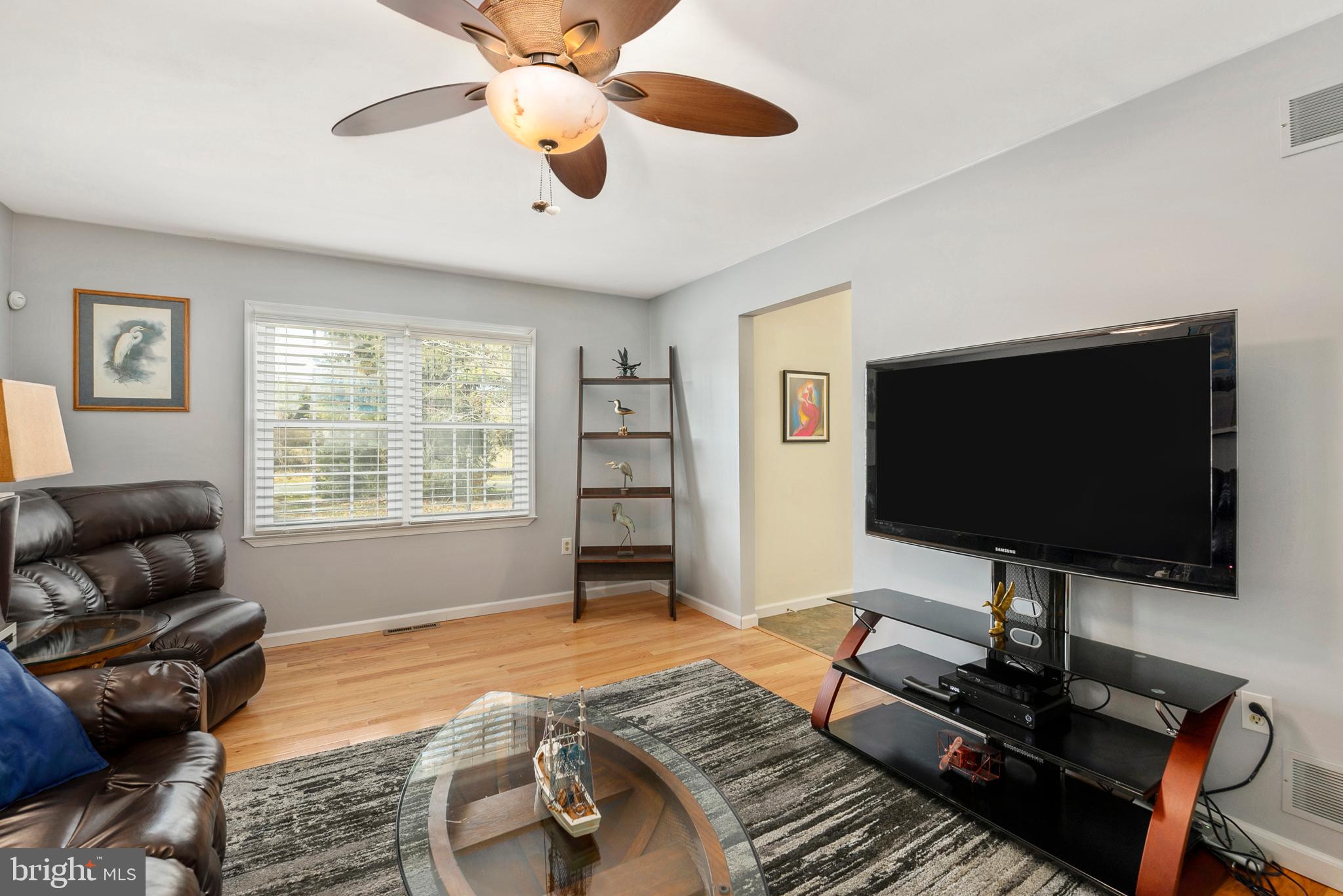 754 Oldfield Point Road Elkton, MD 21921 - Photo 13 of 49 a living room with furniture and a flat screen tv