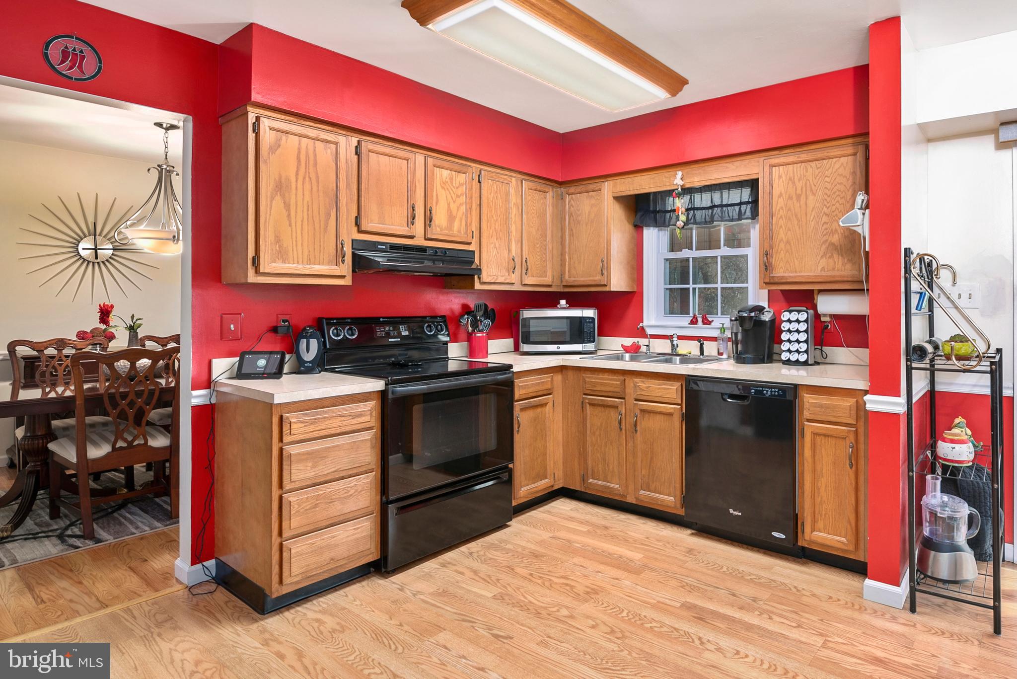 754 Oldfield Point Road Elkton, MD 21921 - Photo 15 of 49 a kitchen with stainless steel appliances granite countertop a stove a sink and a refrigerator