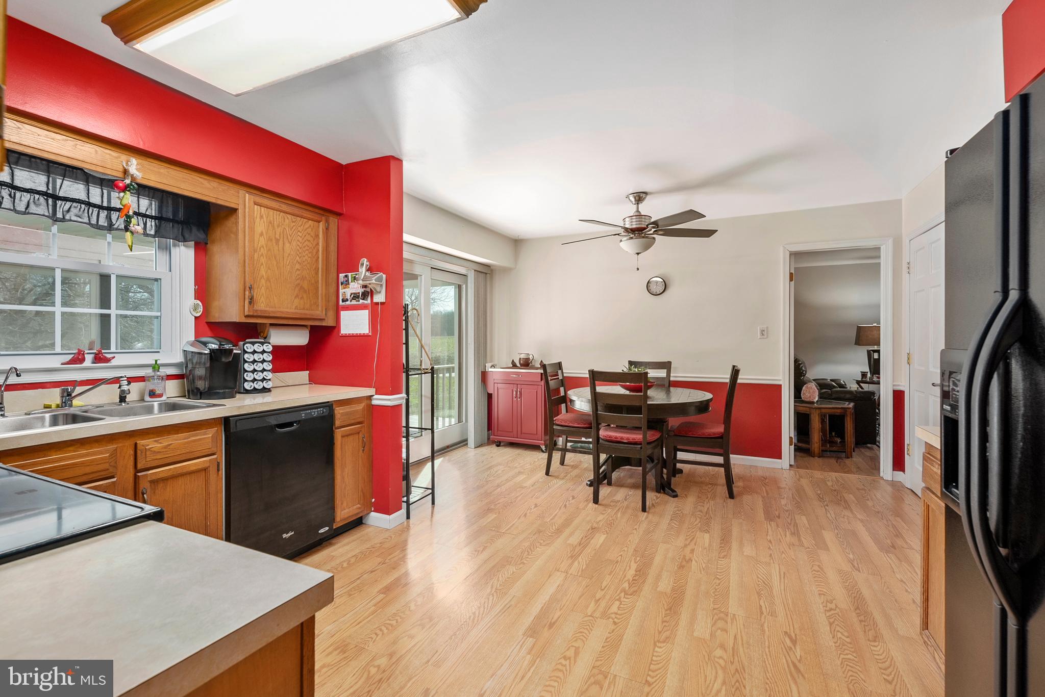 754 Oldfield Point Road Elkton, MD 21921 - Photo 16 of 49 a living room with stainless steel appliances kitchen island granite countertop furniture and a kitchen view